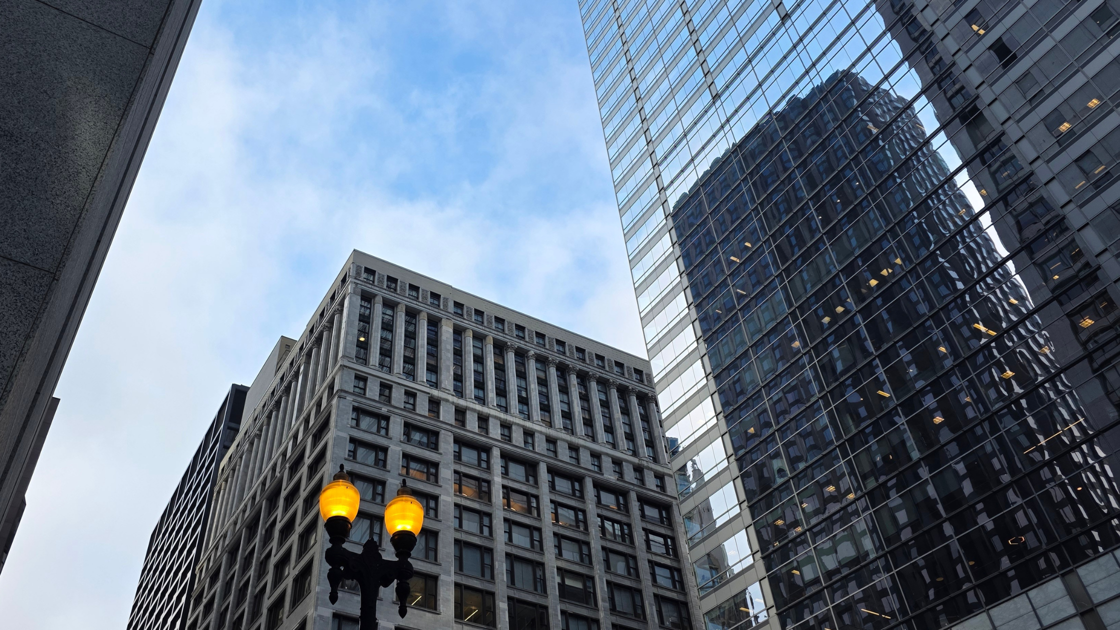 View of Chicago skyscrapers from the ground look up | operations consulting for non-profits